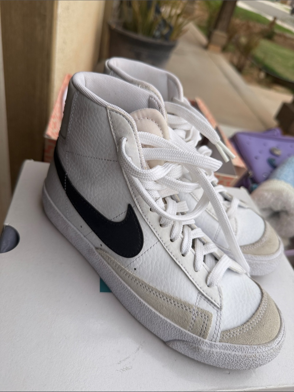 Nike White High-Top Sneakers with Black Swoosh and Light Gray Accents